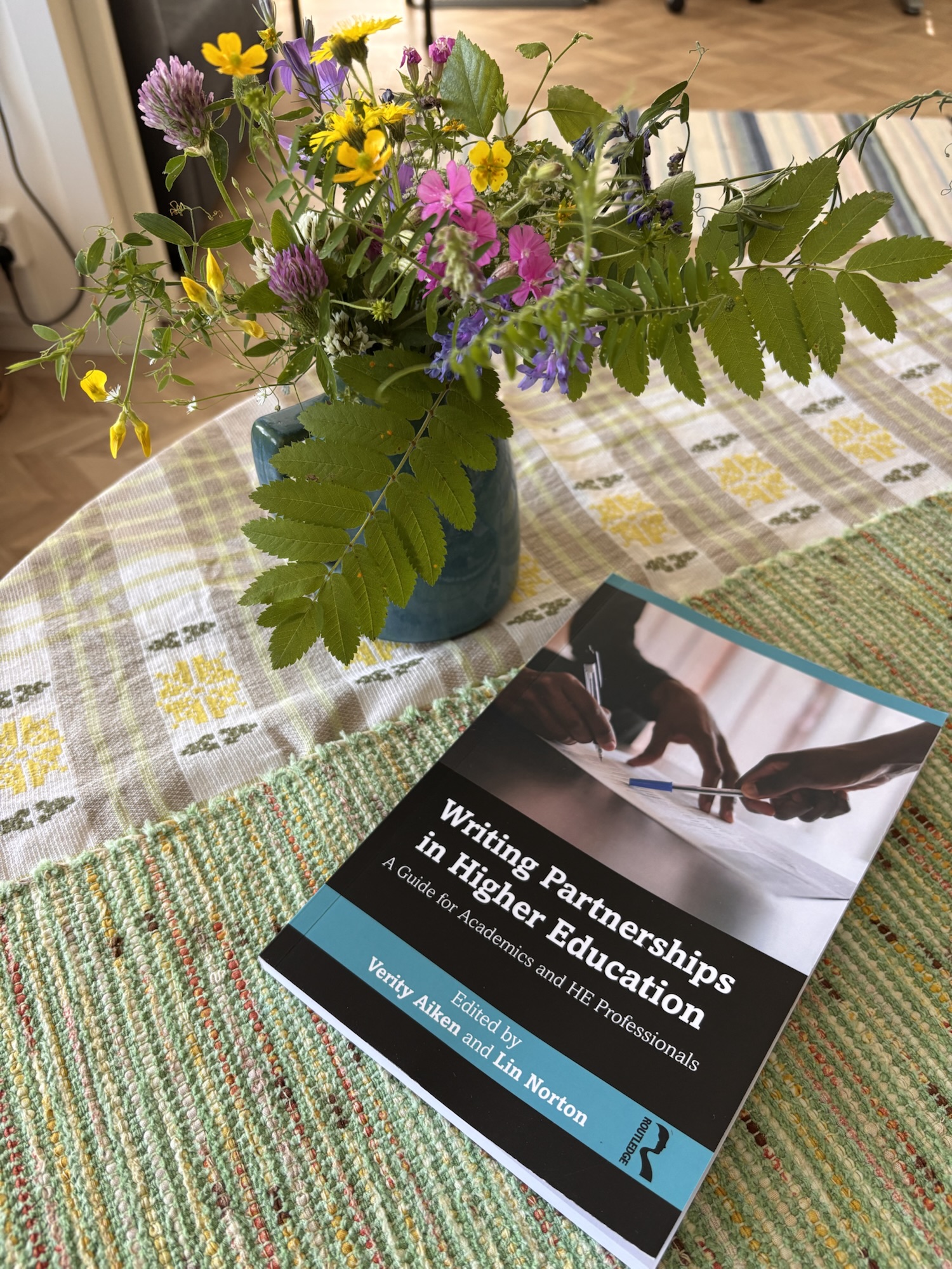 My author copy of Writing Partnerships in Higher Education arrived at midsummer, here it is with some summer wildflowers
